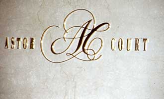 Signage in gold letter part of St. Regis Sheraton Hotel branding and visual identity | CRA Graphic Design