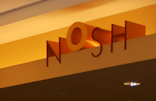  the Architectural signage based on the logo is part of Nosh' restaurant branding and visual identity | Coco Raynes Associates, Inc.