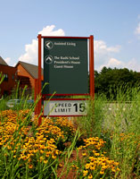 A wayfinding sign 2 indicating direction part of the Wayfinding program of Newbridge on the Charles, Hebrew Senior Life | CRA Consulting